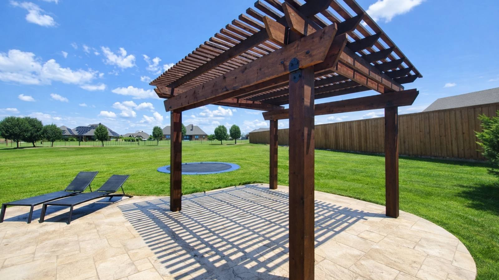 Custom concrete patio and outdoor living space built by Concrete Canvas in the Dallas-Fort Worth area