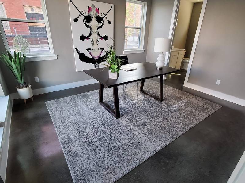 Gray and taupe stained concrete floor in a modern office