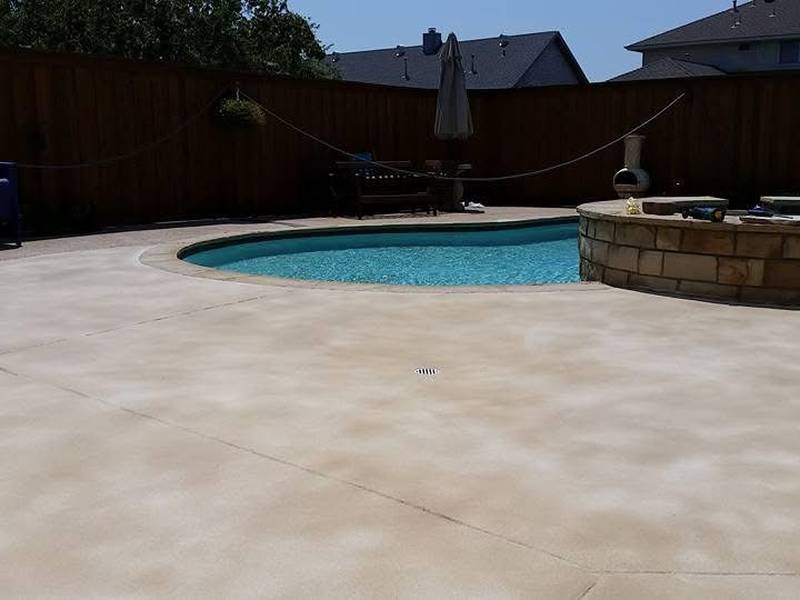 Concrete overlay resurfacing an existing pool deck