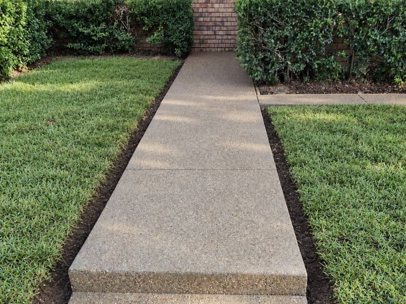 Pea gravel exposed aggregate finish concrete sidewalk