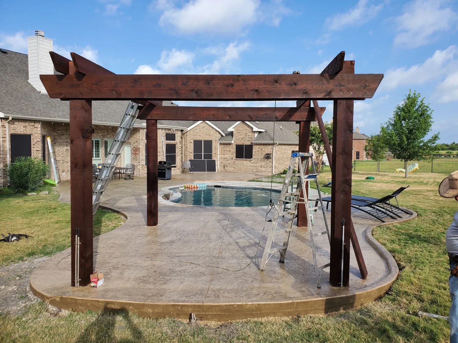 Custom pergola structure built over an outdoor living space in Dallas-Fort Worth
